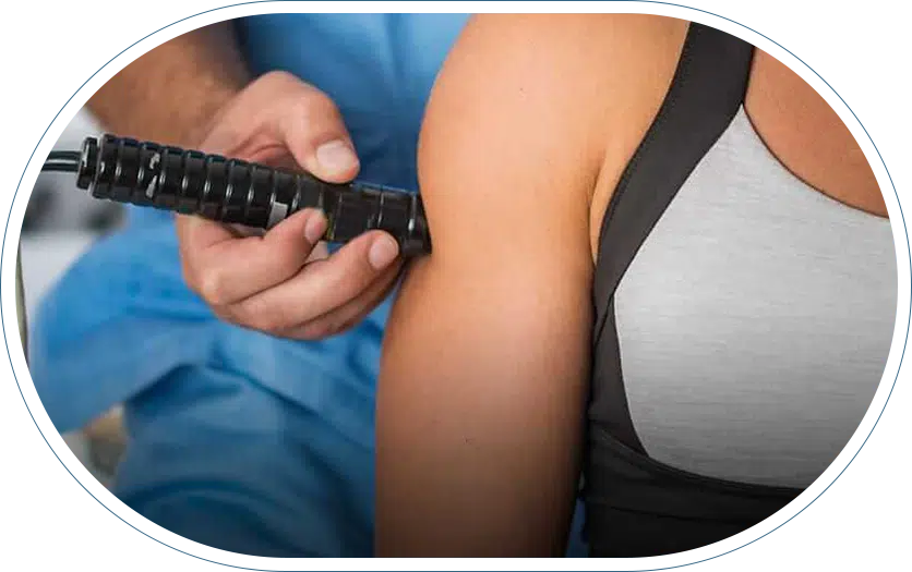 Woman receiving MLS laser therapy treatment.