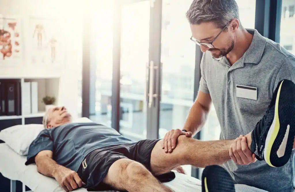 senior man and stretching leg for knee injury