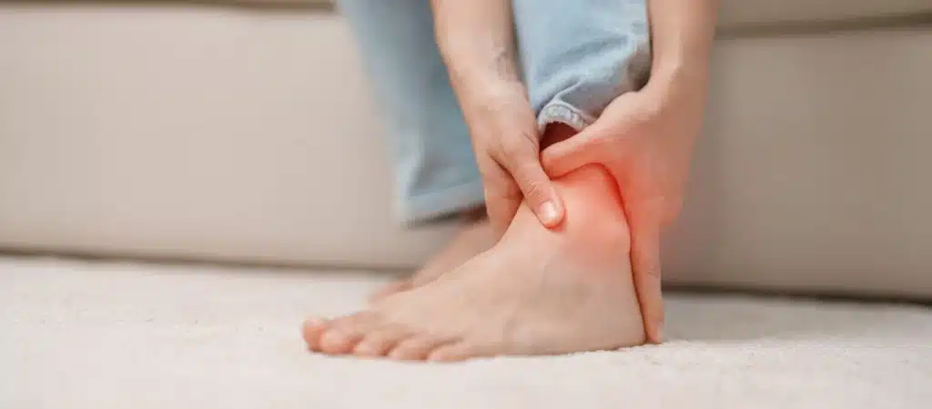 Woman having leg pain due to Shin Splints.